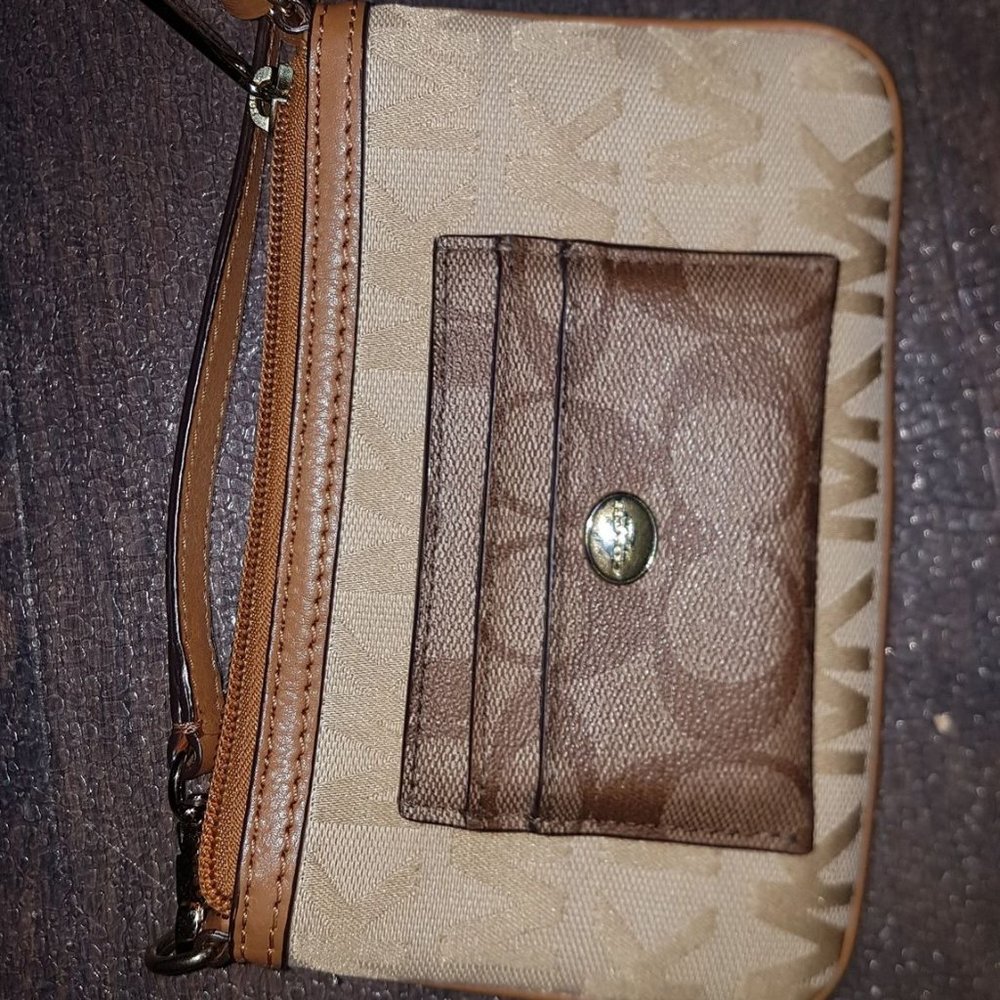 Michael Kors clutch and Coach wallet